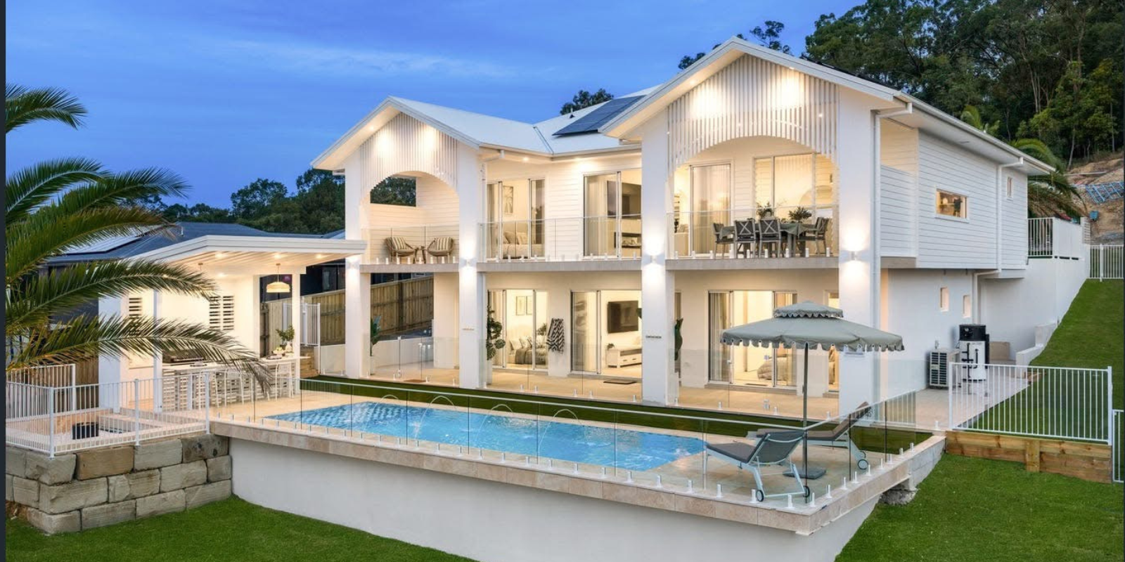 Architectural Gold Coast home at dusk — Adamson Electrical